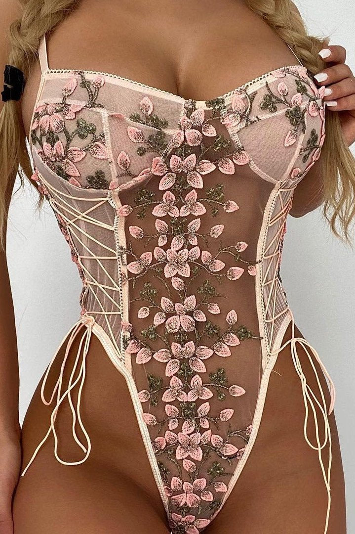 Floral embroidered lace-up sheer bodysuit in pink, side view